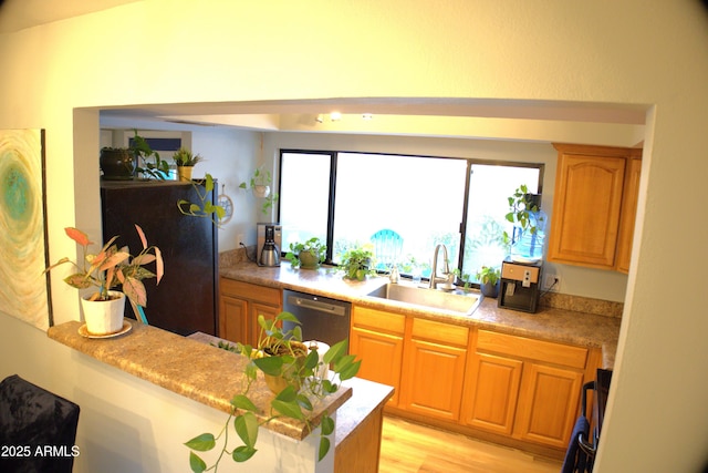 8848 N New World Dr, Glendale, AZ 85302 - kitchen featuring dishwasher, light countertops, and freestanding refrigerator