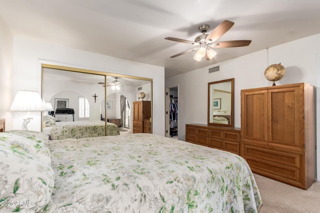 400 W Crofton St, Chandler, AZ 85225 - bedroom featuring light carpet, a closet, arched walkways, and ceiling fan