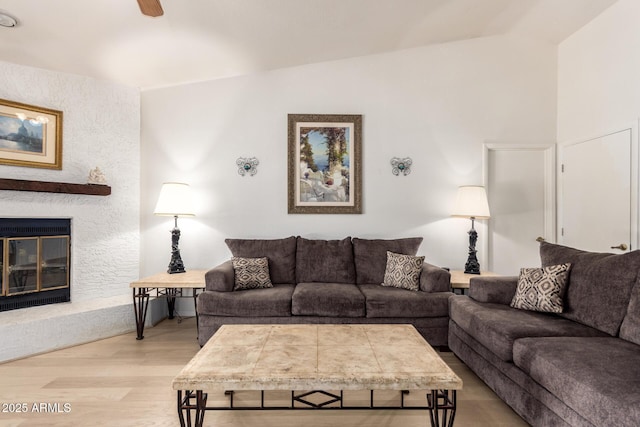 400 W Crofton St, Chandler, AZ 85225 - living room featuring lofted ceiling, light wood-type flooring, a glass covered fireplace, and ceiling fan