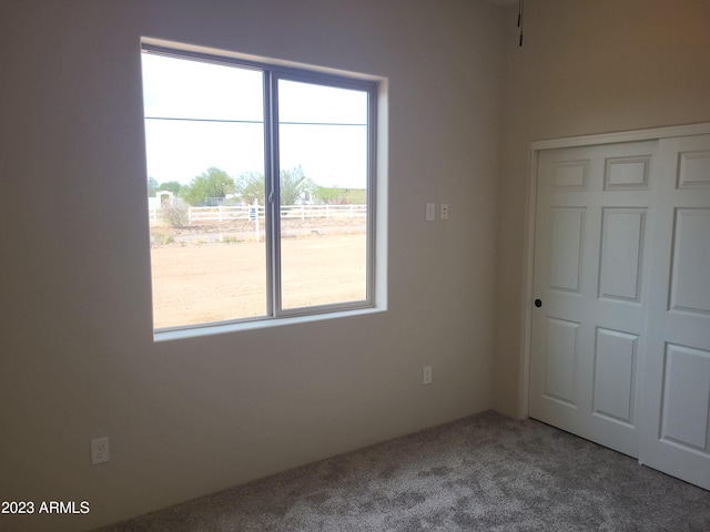 48111 N 7th Ave, New River, AZ 85087 - unfurnished bedroom with a closet and carpet floors