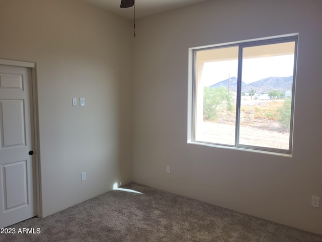 48111 N 7th Ave, New River, AZ 85087 - spare room with a mountain view, carpet, and ceiling fan