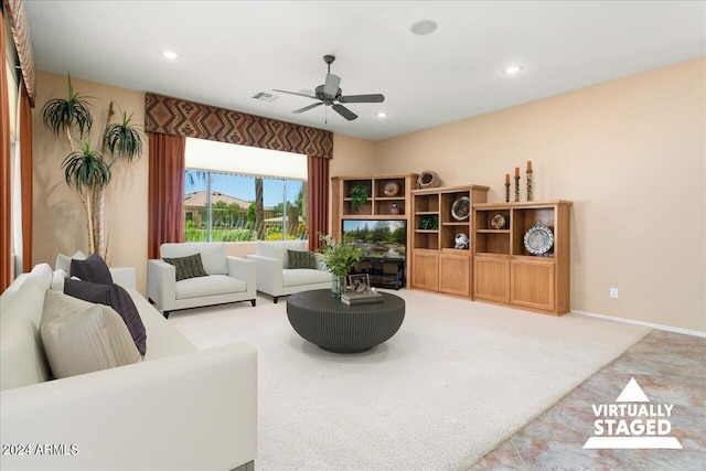 living room with light colored carpet and ceiling fan