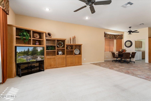 carpeted living room featuring ceiling fan