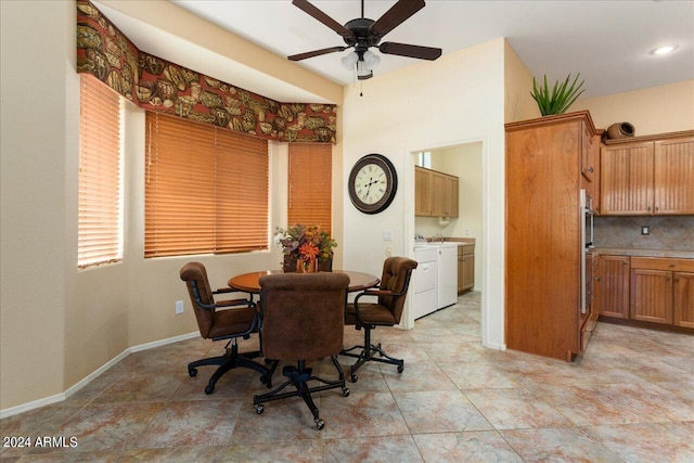 dining area with ceiling fan and washing machine and clothes dryer