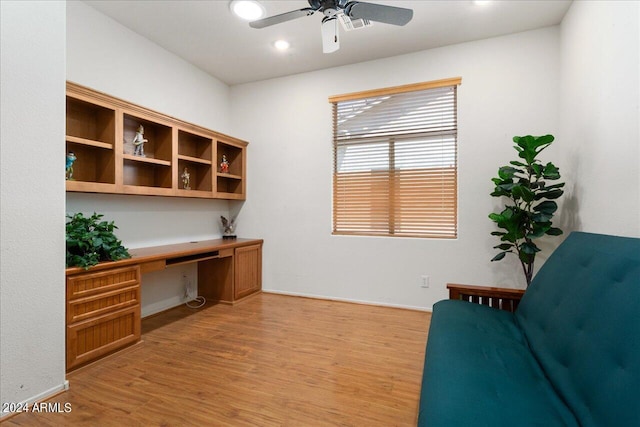 office space with light hardwood / wood-style floors and ceiling fan