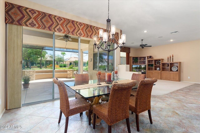 dining room featuring ceiling fan with notable chandelier