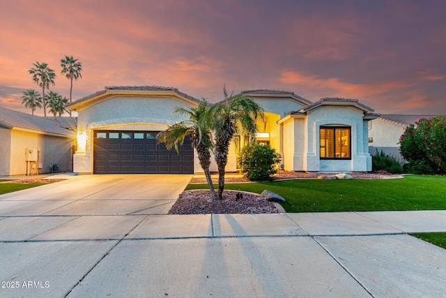 1312 W Bartlett Way, Chandler, AZ 85248 - mediterranean / spanish house featuring concrete driveway, an attached garage, a tiled roof, and stucco siding