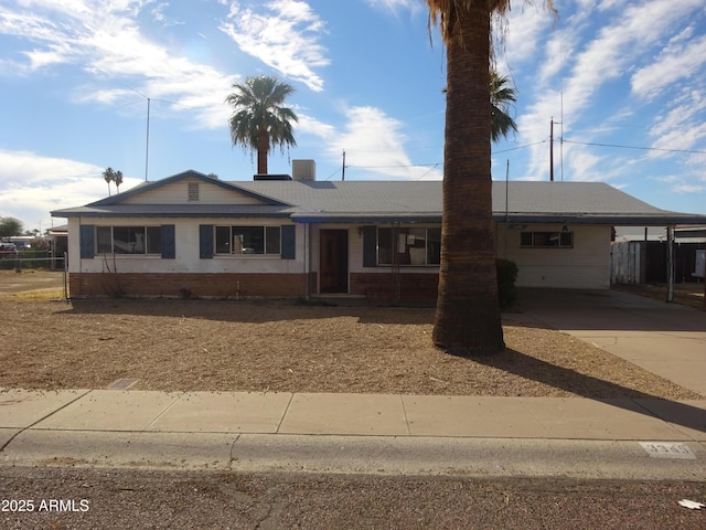 ranch-style house with a carport