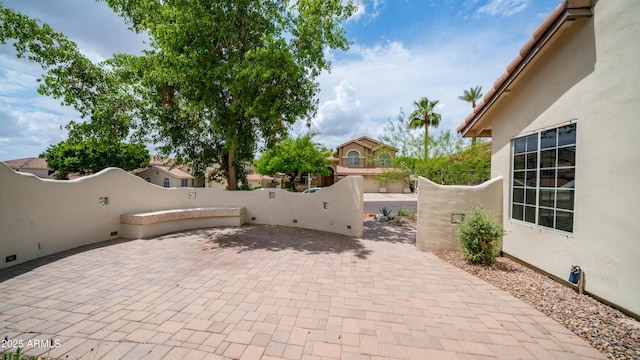 view of patio featuring fence