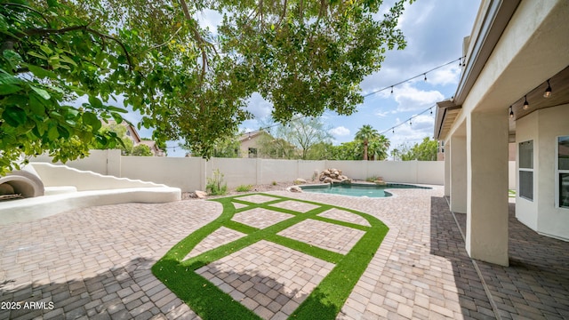 fenced backyard featuring a patio area