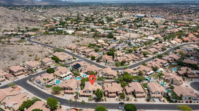 aerial overview of property's location with a mountainous background