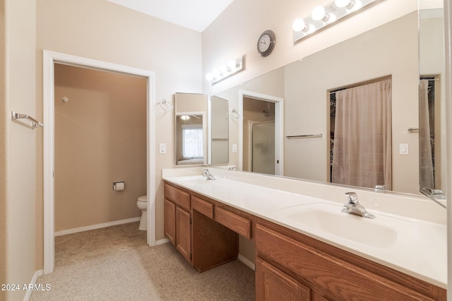 bathroom with a shower, vanity, and toilet