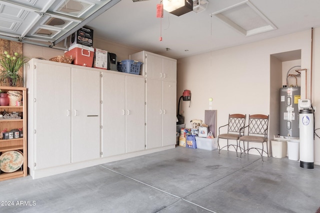 garage with water heater and a garage door opener