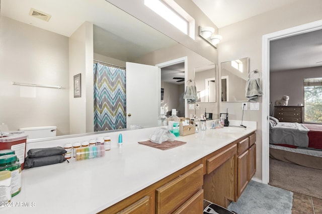 bathroom with tile patterned floors, vanity, and toilet