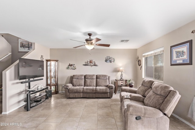 living room featuring ceiling fan and light tile patterned floors