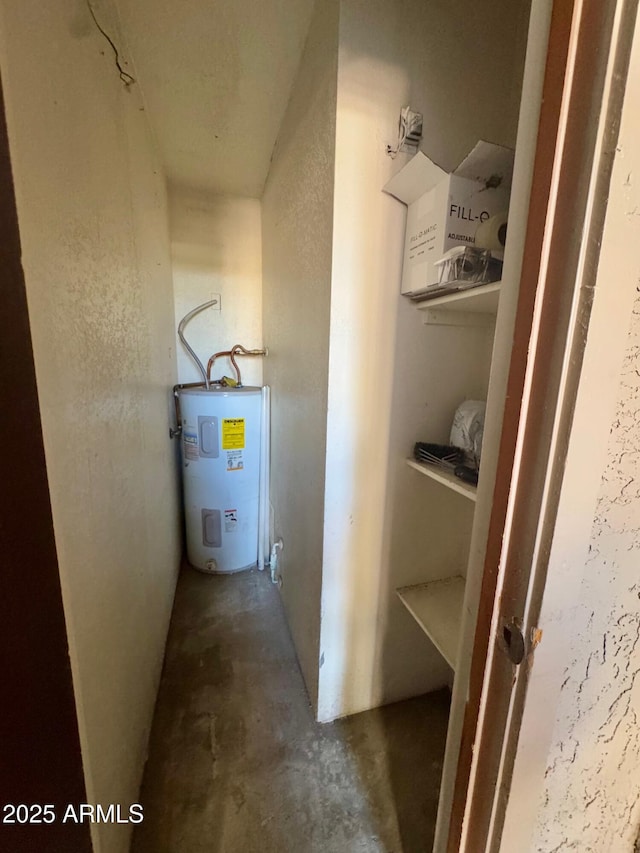 utility room featuring electric water heater