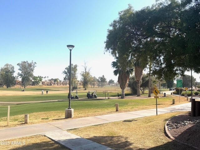 surrounding community featuring a lawn