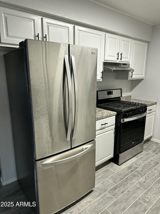 kitchen featuring appliances with stainless steel finishes, stone countertops, and white cabinets