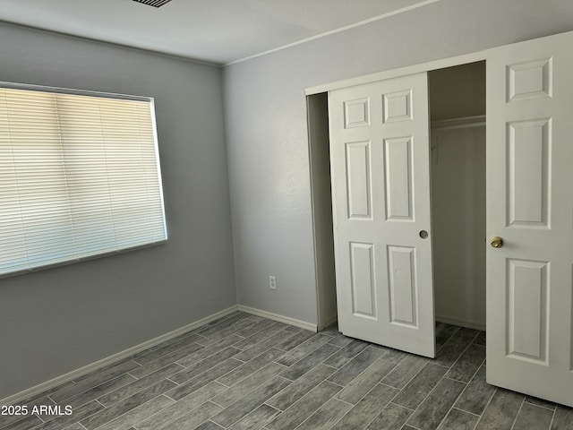 unfurnished bedroom featuring a closet