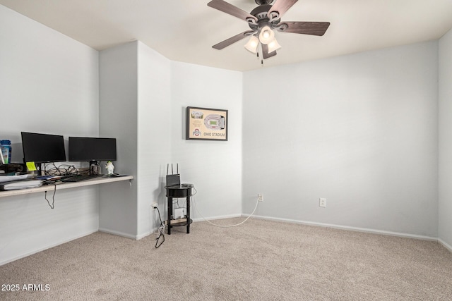 office area featuring baseboards, light colored carpet, and ceiling fan