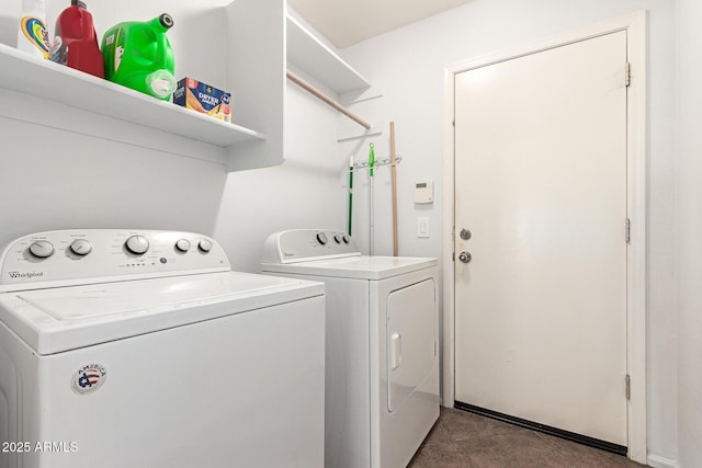 clothes washing area with washing machine and dryer and laundry area