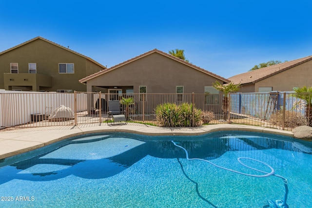 view of swimming pool featuring a fenced in pool, fence, and a patio