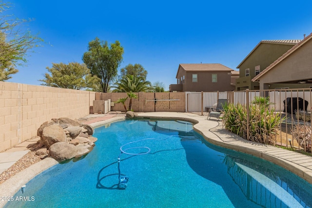 view of pool featuring a fenced backyard and a fenced in pool