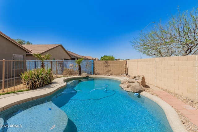 view of pool featuring a fenced backyard and a fenced in pool