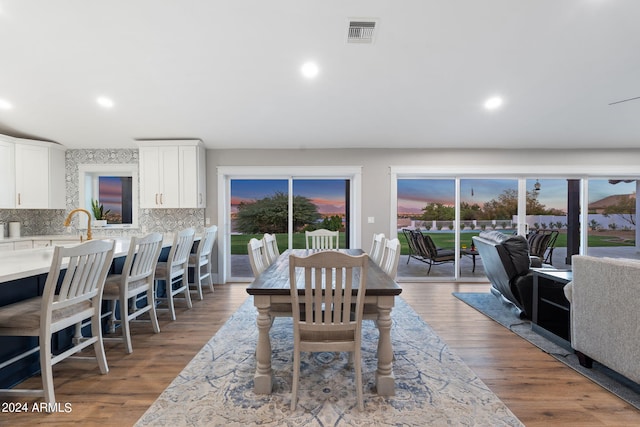 dining space featuring hardwood / wood-style flooring