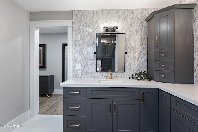 bathroom featuring hardwood / wood-style flooring and vanity