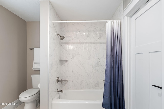 bathroom with toilet and shower / tub combo with curtain