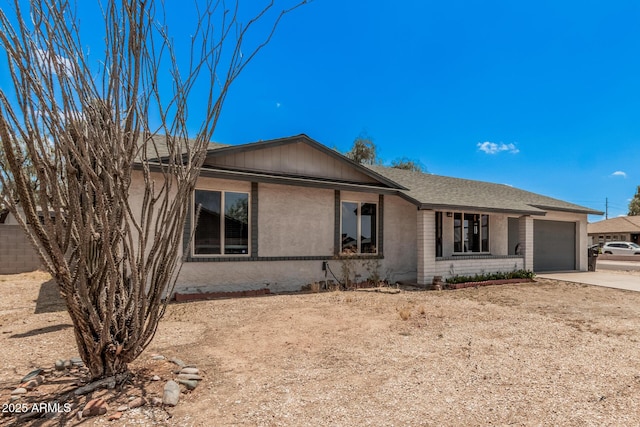 17201 N 35th Dr, Glendale, AZ 85308 - ranch-style house with an attached garage, concrete driveway, and brick siding