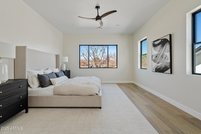 bedroom featuring light hardwood / wood-style flooring and ceiling fan