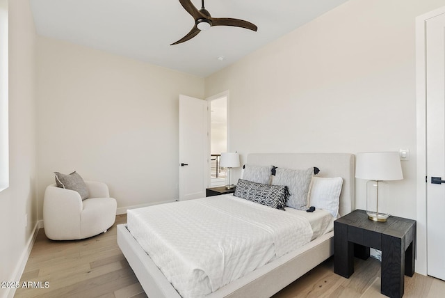 bedroom with ceiling fan and light hardwood / wood-style flooring