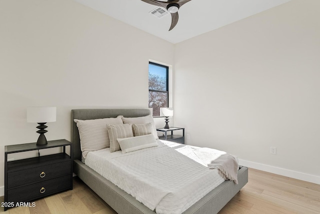 bedroom featuring light hardwood / wood-style flooring and ceiling fan