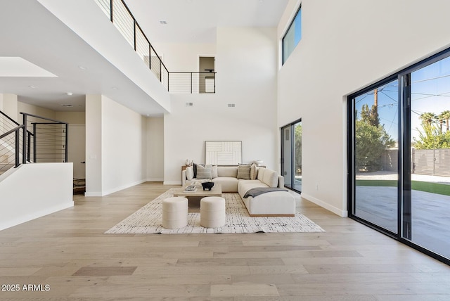 living room with light hardwood / wood-style flooring