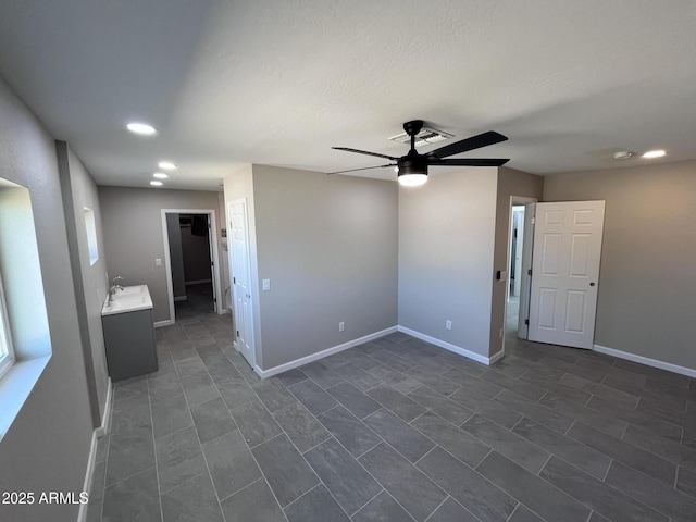 unfurnished room featuring ceiling fan, recessed lighting, and baseboards