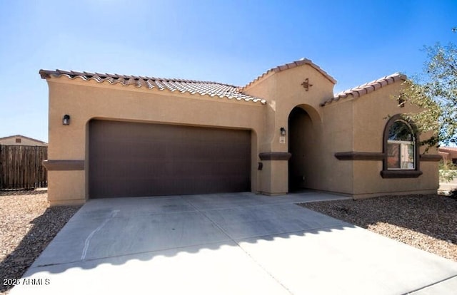 mediterranean / spanish-style home featuring a garage