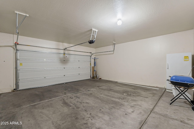 garage with baseboards and a garage door opener