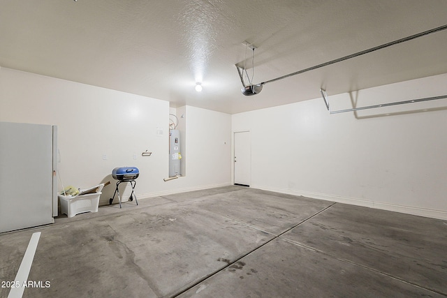 garage with water heater, freestanding refrigerator, and a garage door opener