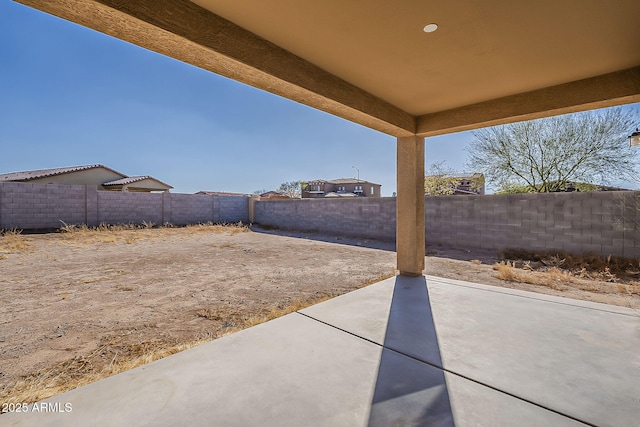 view of yard featuring a patio area and a fenced backyard