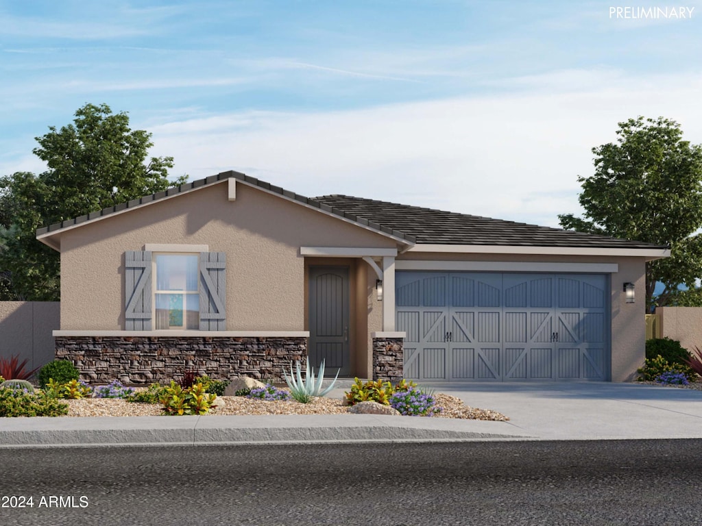 16066 W Prickly Pear Trl, Surprise, AZ 85387 - ranch-style house with an attached garage, stone siding, and stucco siding