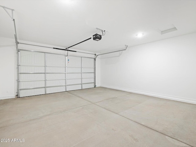 garage featuring baseboards and a garage door opener