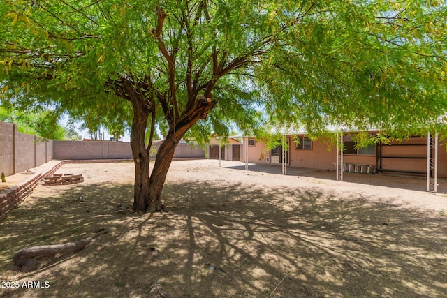 view of yard with a patio and a fenced backyard