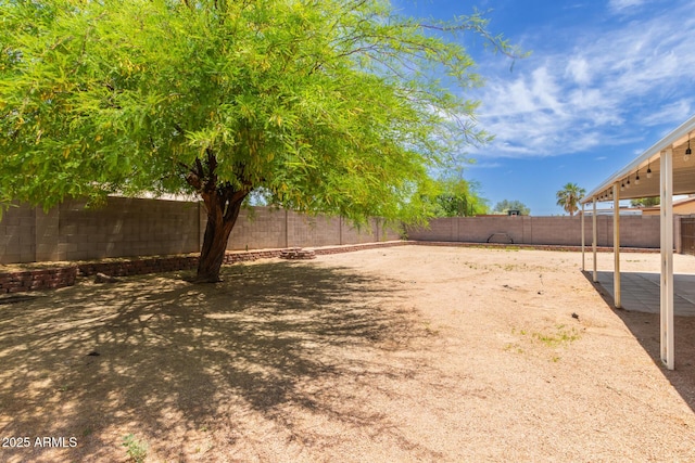 view of yard featuring a patio and a fenced backyard