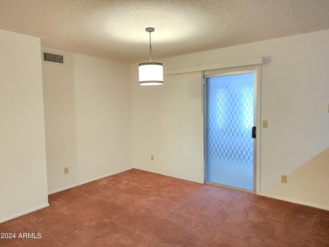 unfurnished room with a drop ceiling, plenty of natural light, and carpet floors