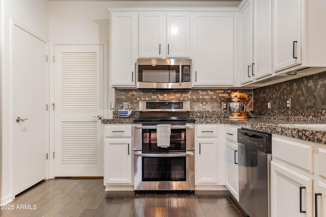 706 E Washington St Unit 124, Phoenix, AZ 85034 - kitchen featuring appliances with stainless steel finishes, white cabinetry, backsplash, and dark countertops