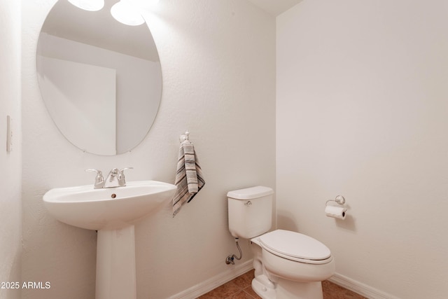 706 E Washington St Unit 124, Phoenix, AZ 85034 - half bathroom featuring toilet and tile patterned floors