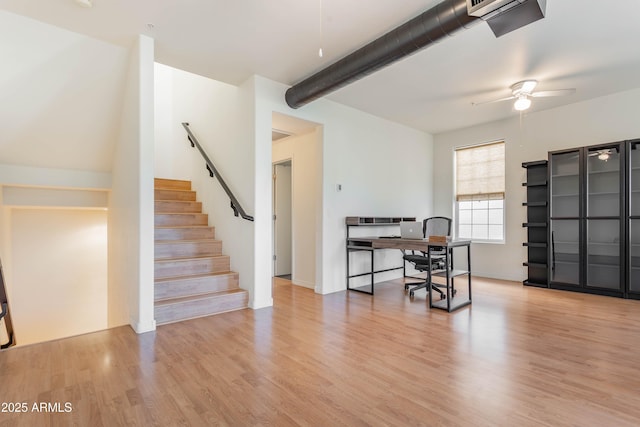 706 E Washington St Unit 124, Phoenix, AZ 85034 - dining area with ceiling fan, wood finished floors, a desk, and stairway