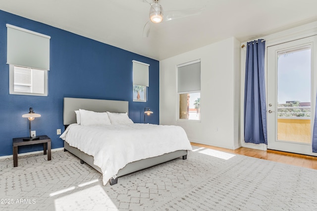 706 E Washington St Unit 124, Phoenix, AZ 85034 - bedroom with wood finished floors and a ceiling fan